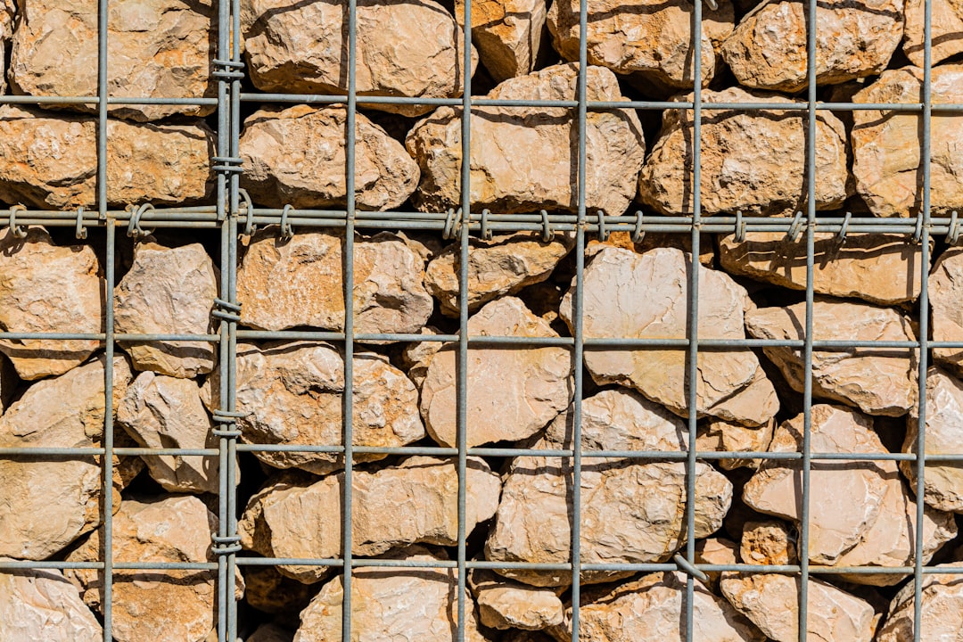a bunch of rocks that are in a cage